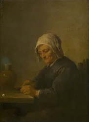 Alte Frau beim Tabakschneiden